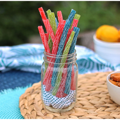 Sour Punch Twists, 6" Individually Wrapped Candy, Assorted Flavors, in a jar near other poolside snacks