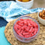 Sour Punch Strawberry Bites in a bowl near other poolside snacks
