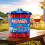 Red Vines Jar on a picnic table with a man grilling in the background 