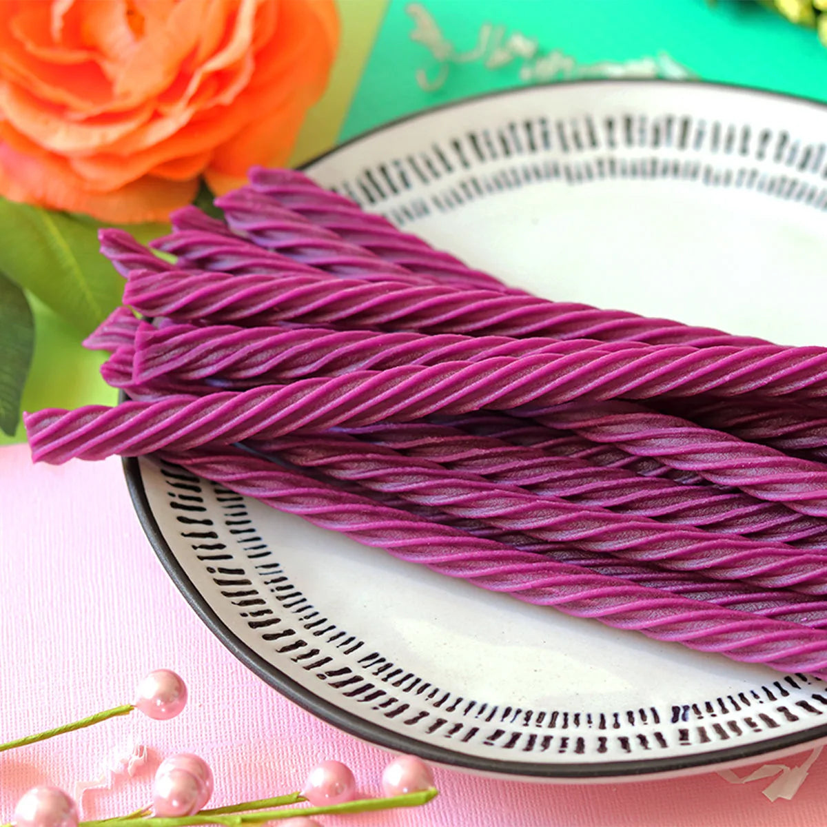 Red Vines Grape Twists licorice candy in a pastel colored spring scene