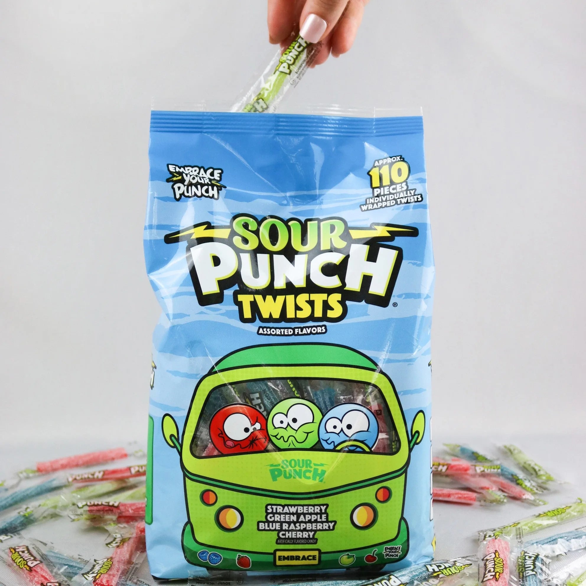 Hand reaching into bag to grab a SOUR PUNCH Individually Wrapped Candy Twist