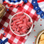 Sour Punch Strawberry Bites on a picnic table with patriotic decorations