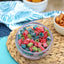 Bowl of Sour Punch Assorted Mini candy on a beach blanket with other salty snacks