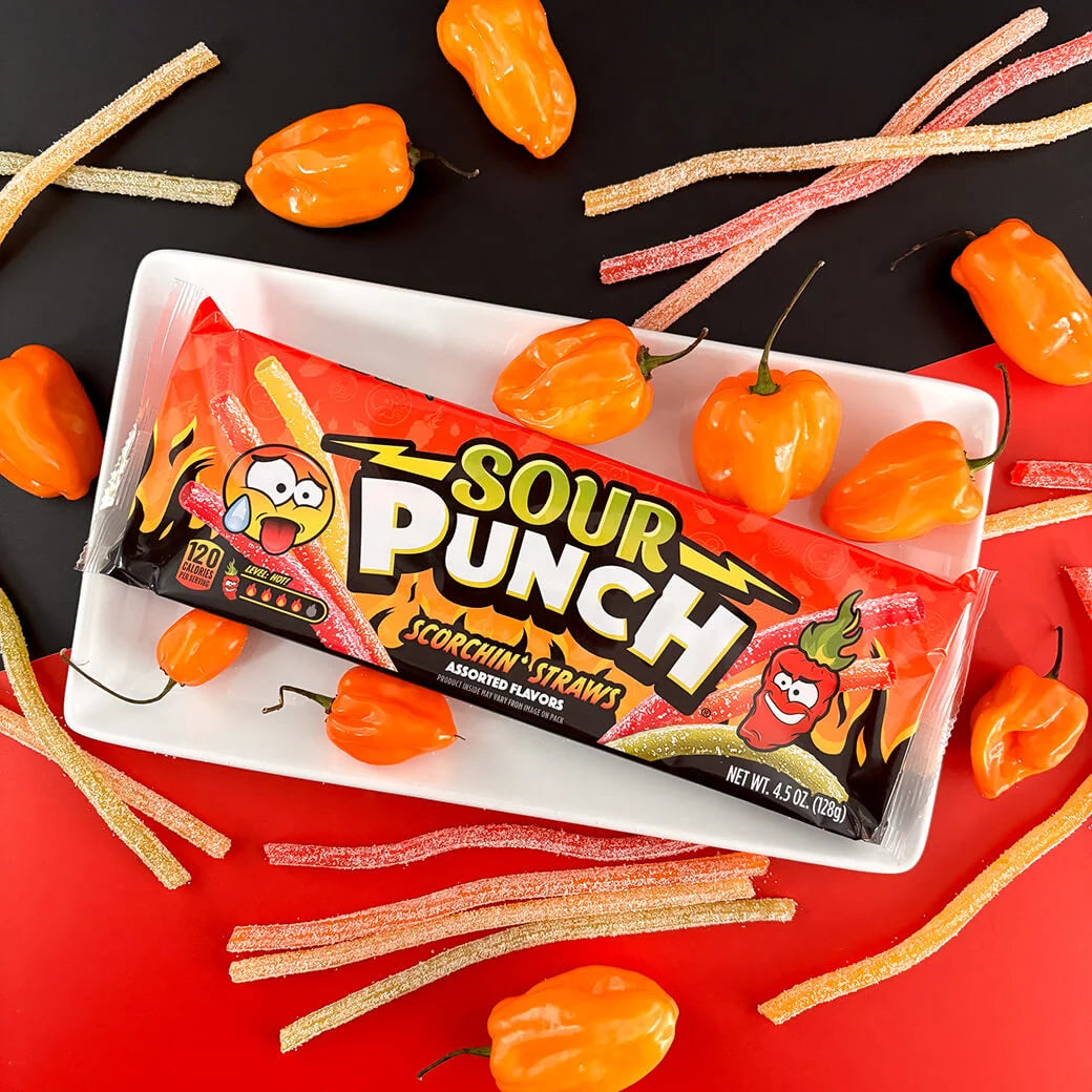 Sour Punch Scorchin' Straws Tray on a plate with orange hot peppers