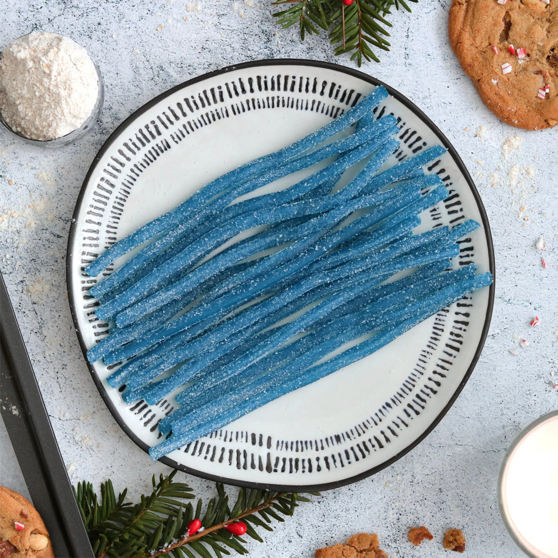 Blue Sour Straws with holiday cookies