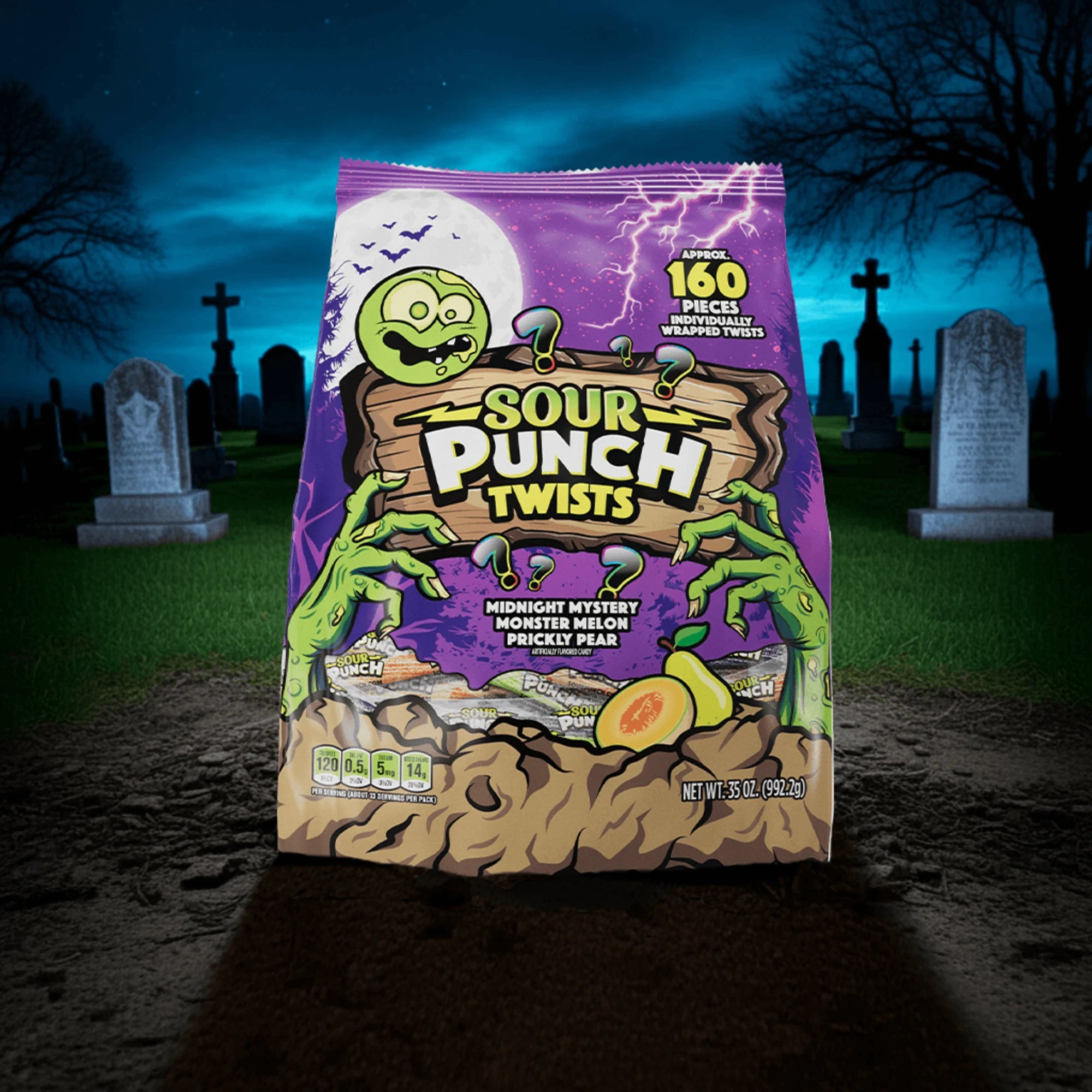 Sour Punch individually wrapped Halloween Twists in a graveyard at night