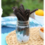 Red Vines Black Licorice Candy Twists in a jar near other poolside snacks