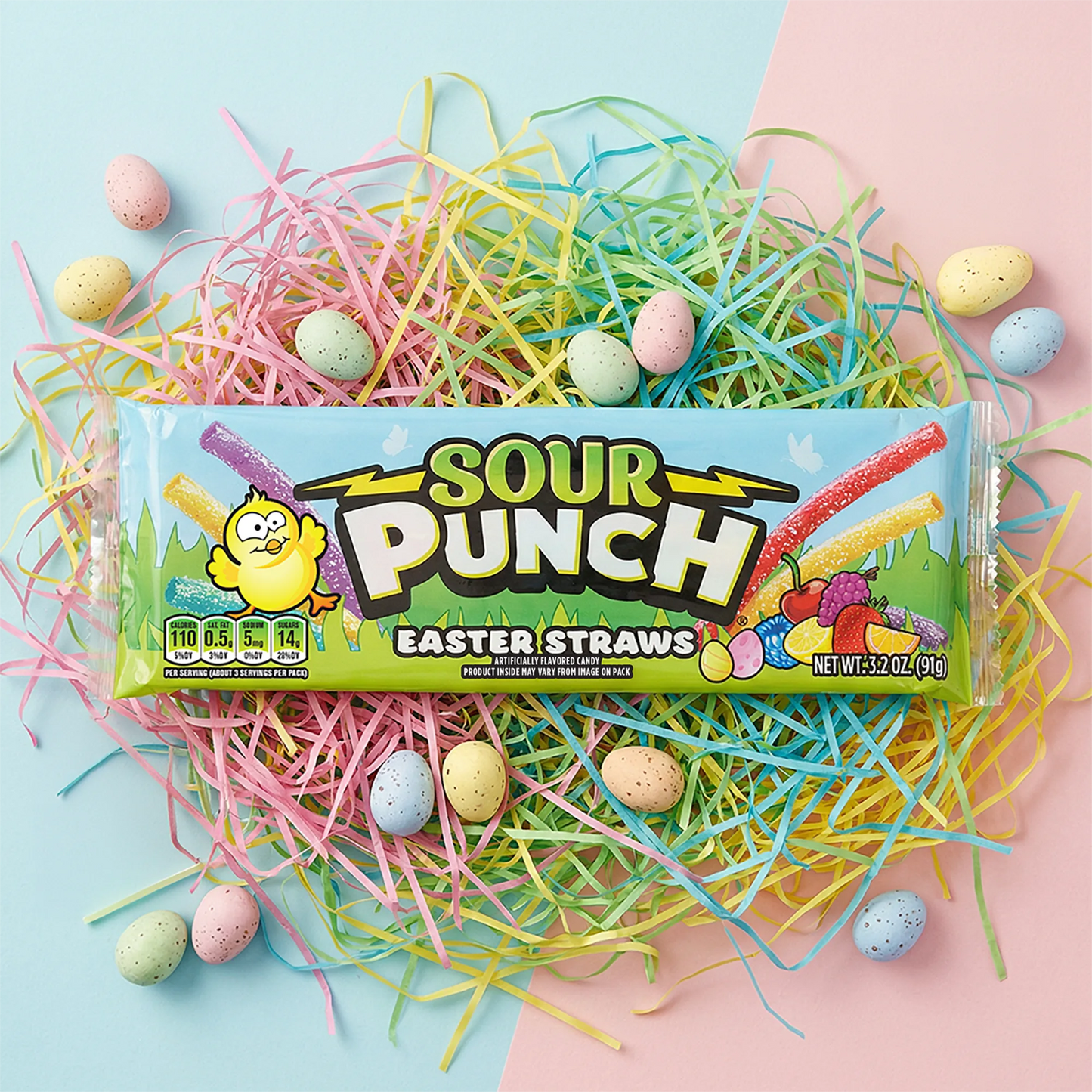 Sour Punch Easter Straws on a pile of colorful confetti, surrounded by pastel dyed Easter eggs