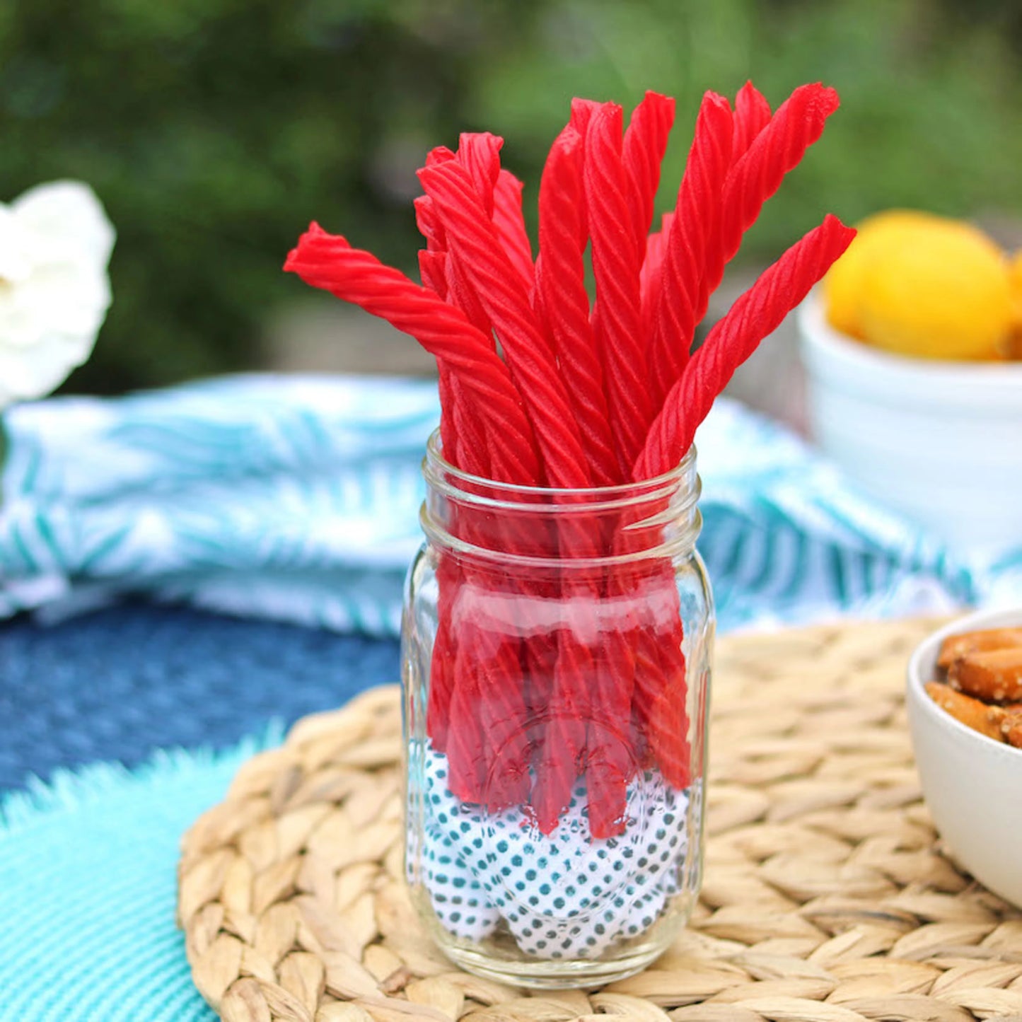 Red Vines Original Red Licorice Twists in a jar near other poolside snacks