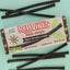 RED VINES Made Simple Black Licorice Twists 4oz Tray on a blue background with candy twists