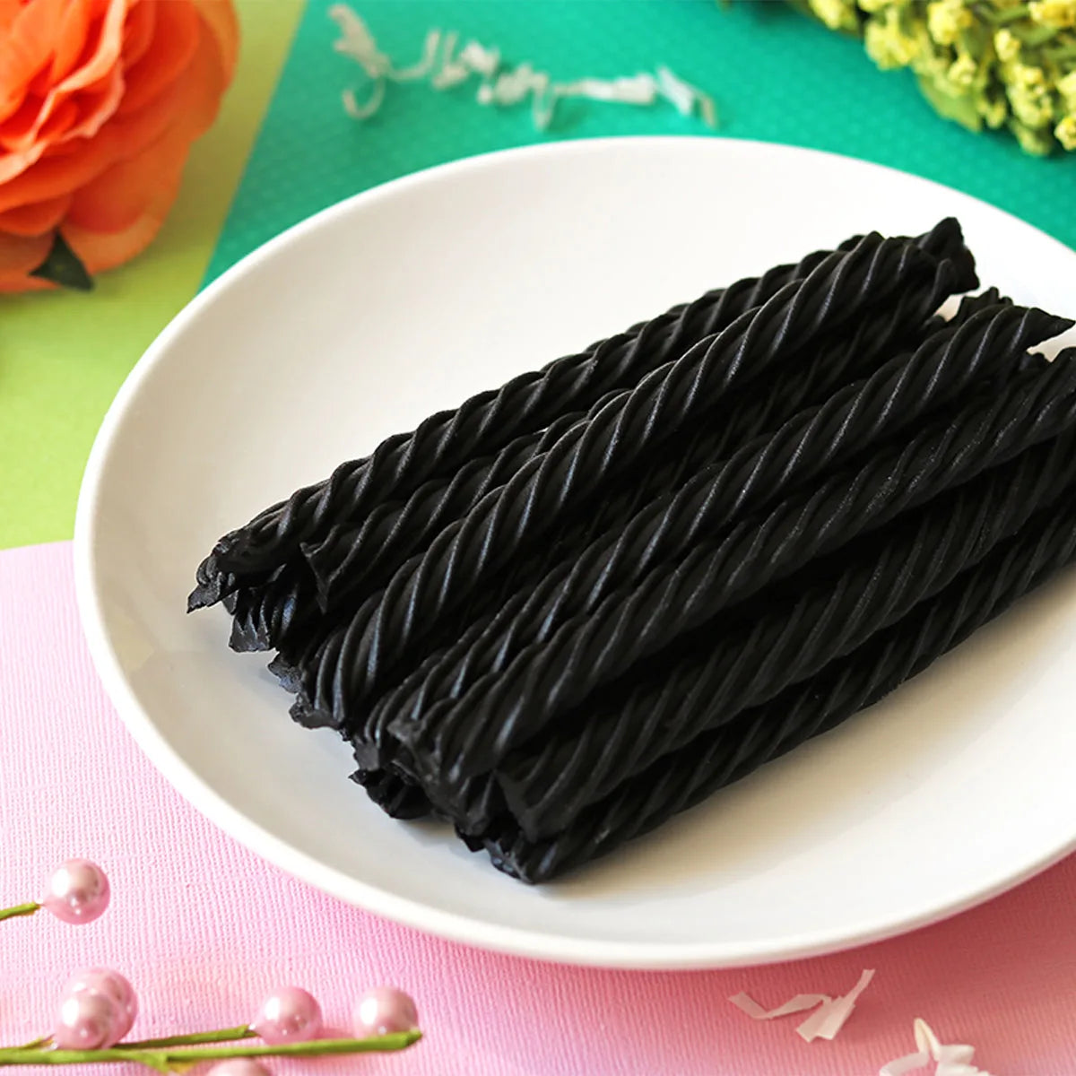 Red Vines Sugar Free Black Licorice Twists  in a pastel colored spring scene