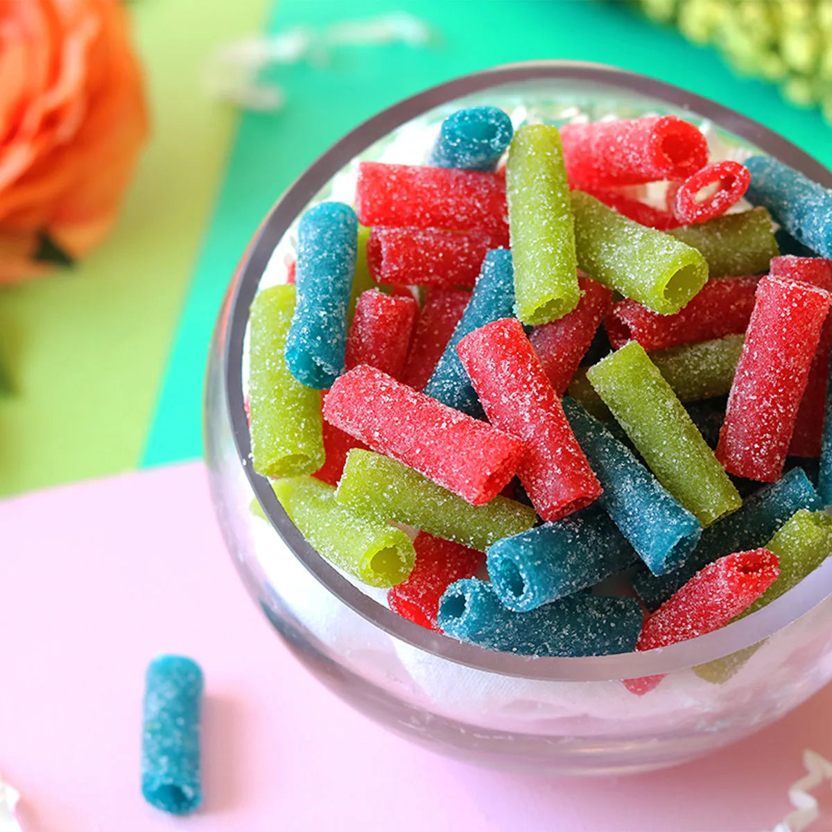 Sour Punch Assorted Bites candy in a pastel colored spring scene