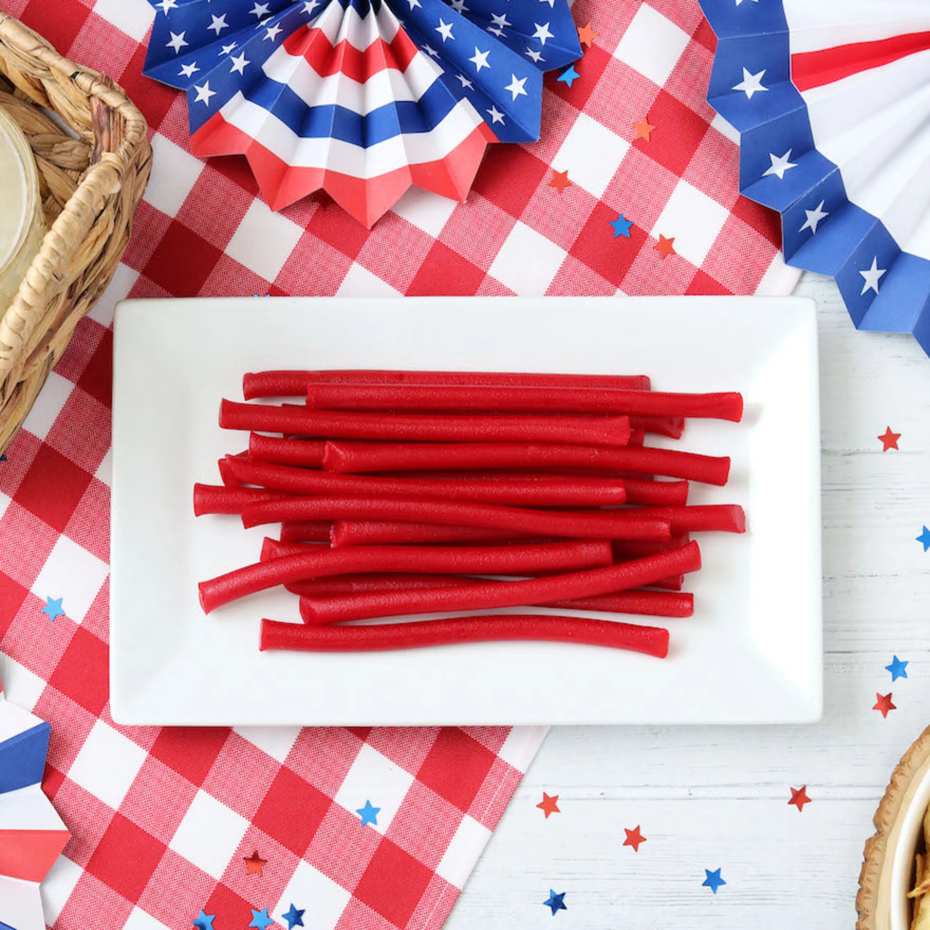 Red Vines Red Ropes Licorice Candy on a picnic table with patriotic decorations
