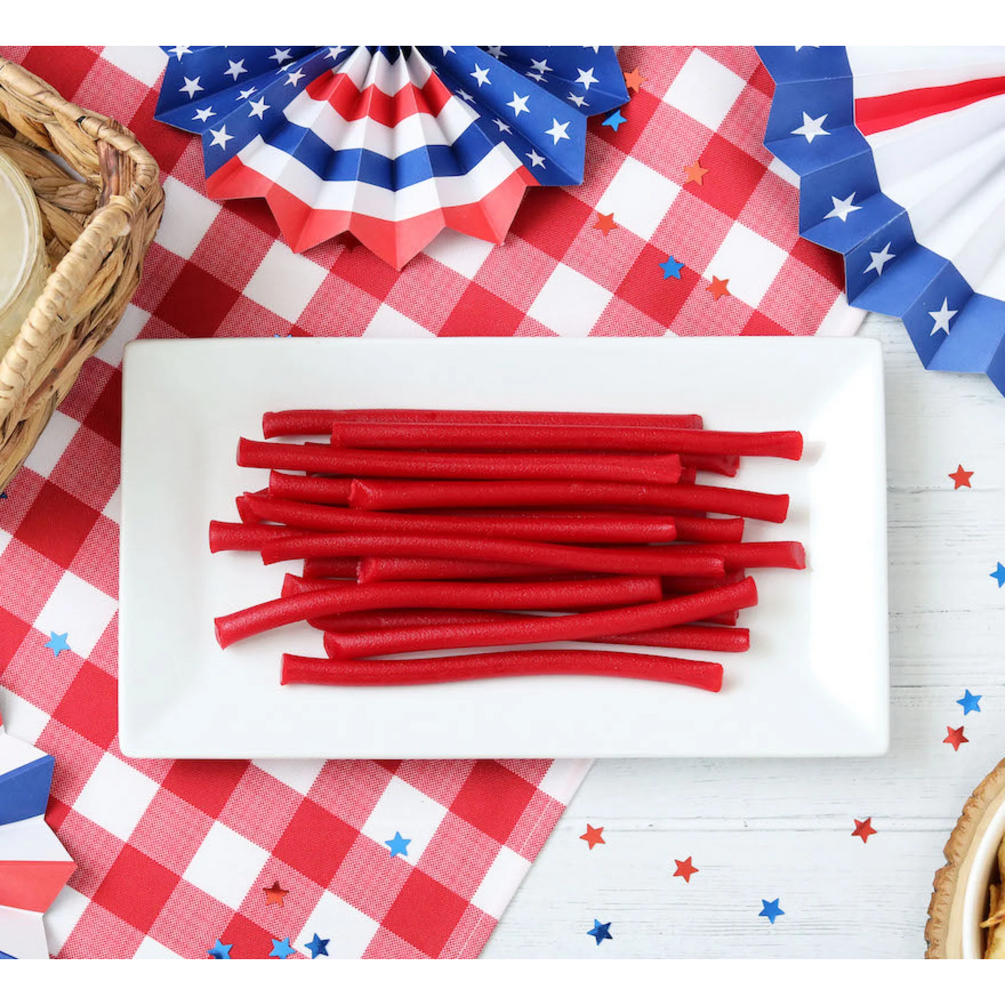 Red Vines Red Ropes Licorice Candy on a picnic table with patriotic decorations