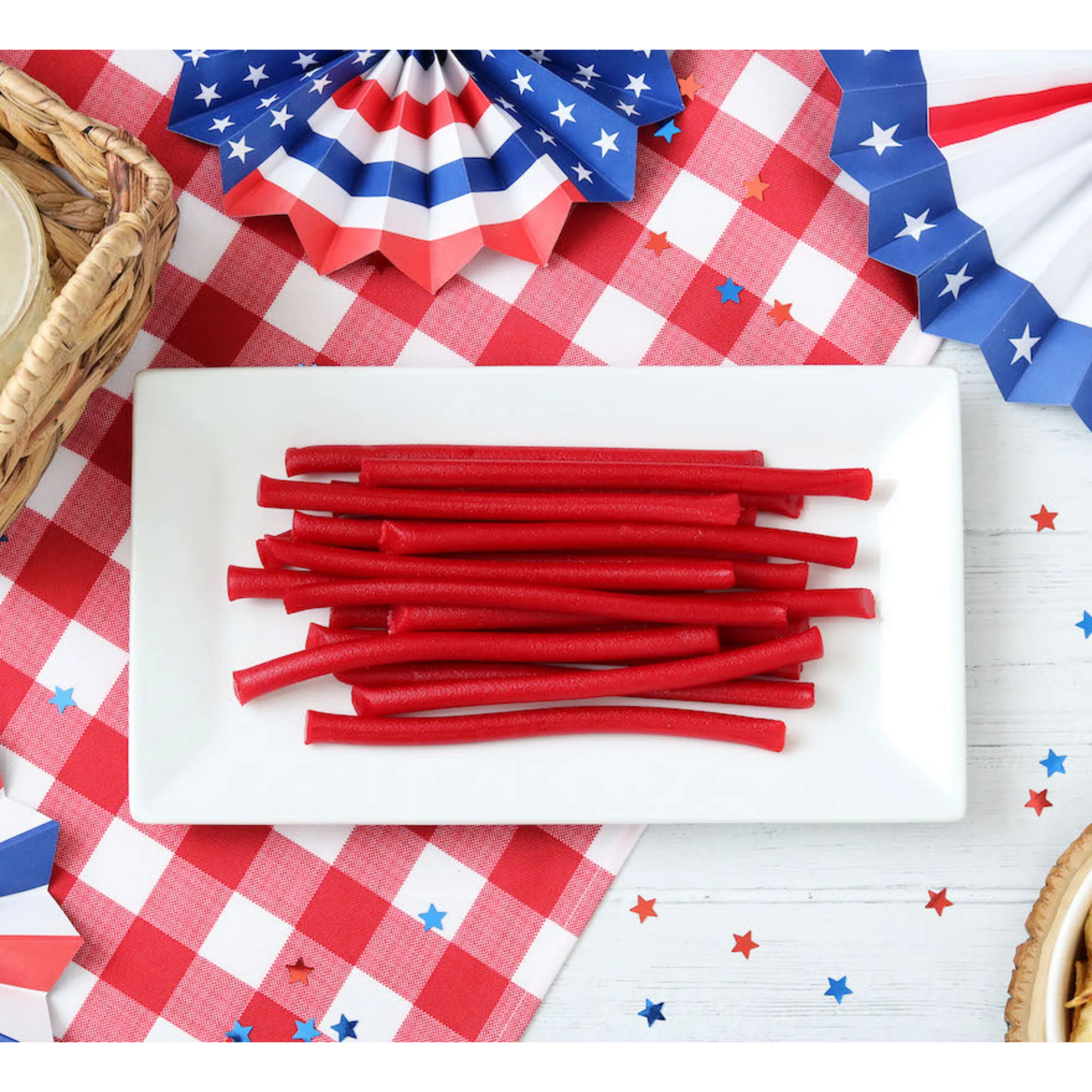 Red Vines Red Ropes Licorice Candy on a picnic table with patriotic decorations