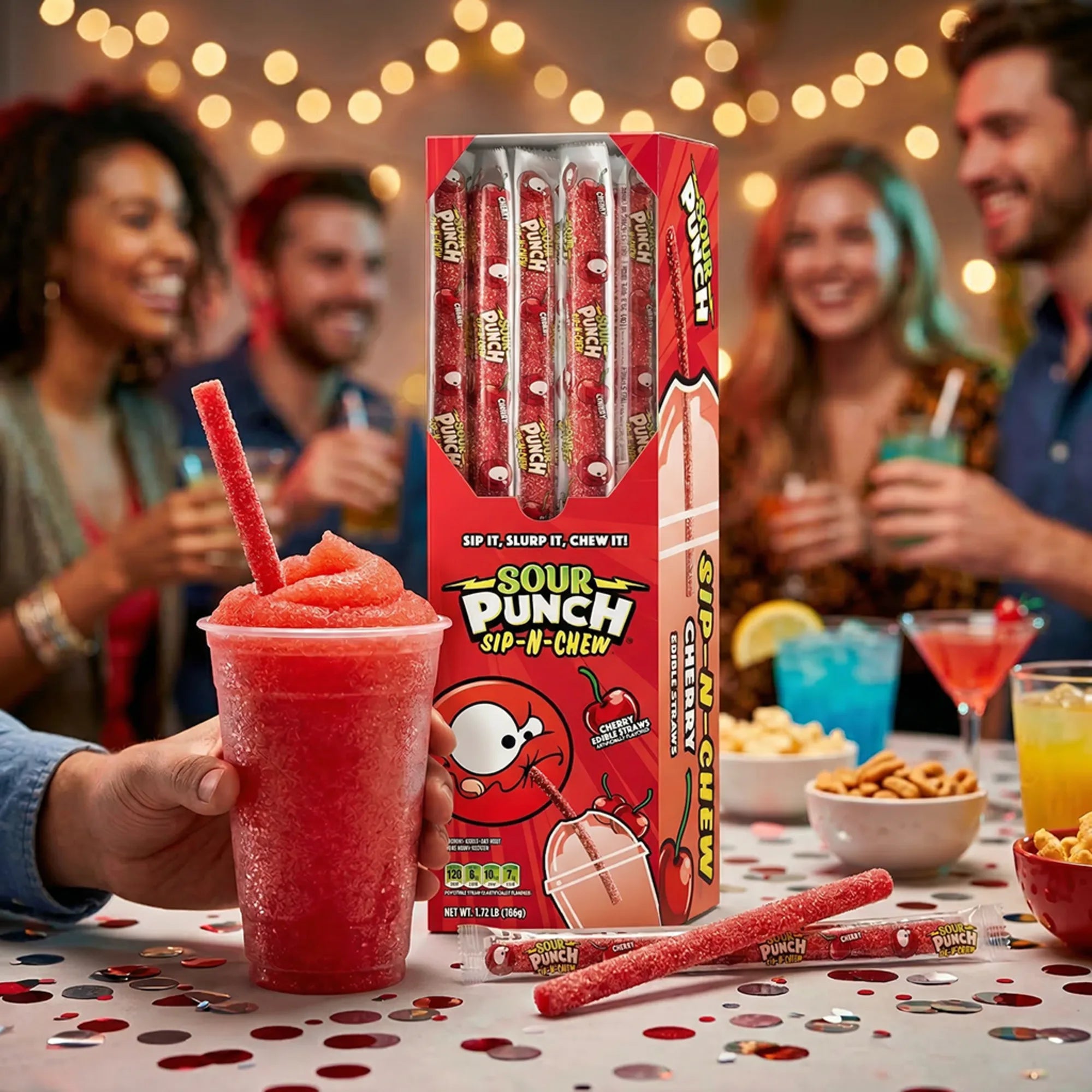 Sour Punch edible straws with a red slushie at a party, surrounded by people and snacks.