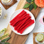 Red Vines Sugar Free Strawberry Licorice Twists on a plate surrounded by spring flowers and other snacks