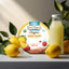 Torie & Howard Meyer Lemon & Raspberry Organic Hard Candy 2oz Tin with lemons and a glass bottle of lemonade