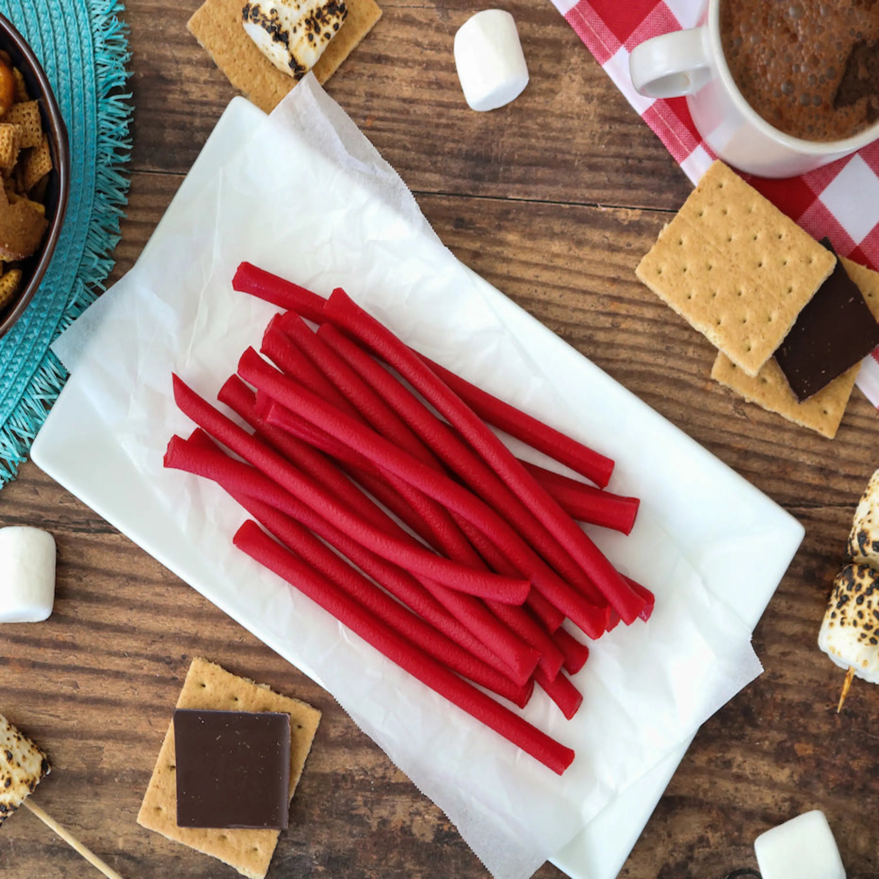 Red Vines Red Ropes Licorice Candy alongside s'mores supplies