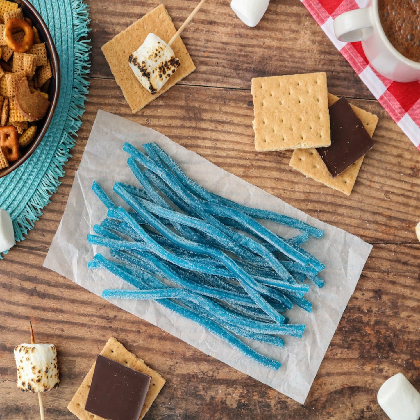 Sour Punch Blue Raspberry Straws Candy alongside s'mores supplies