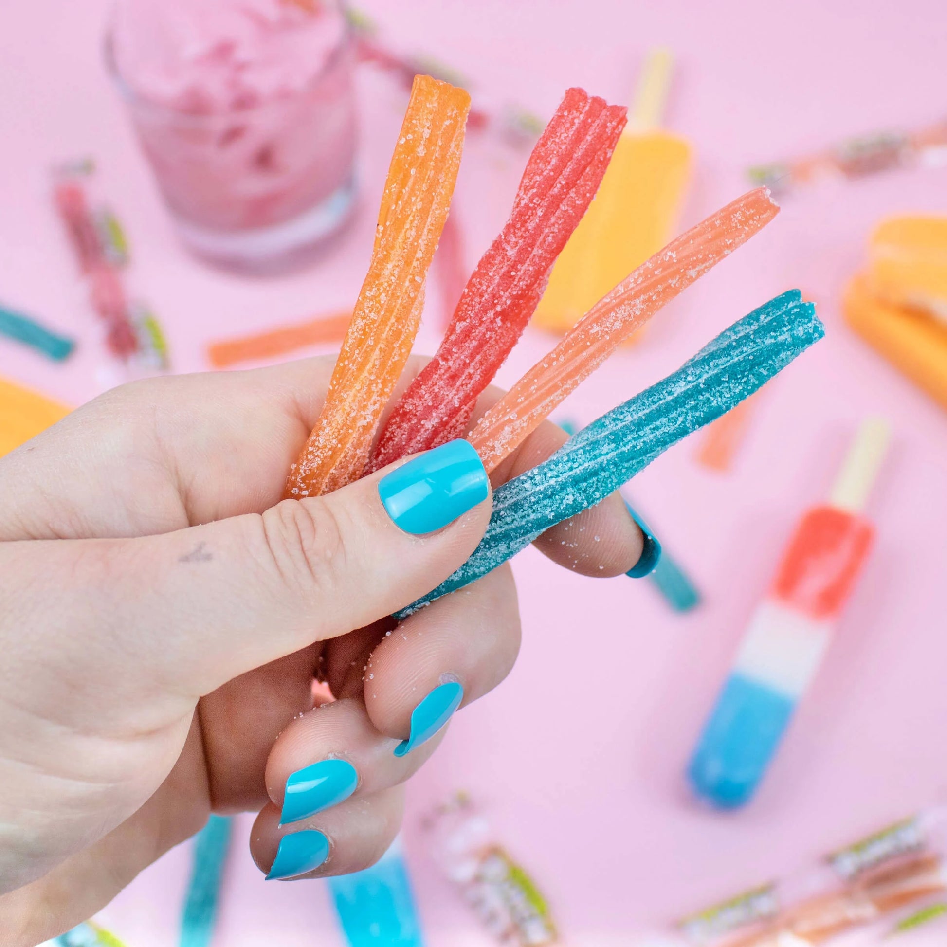 Person holding every flavor of SOUR PUNCH Ice Cream Truck Twists summer candy