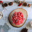 Red Sour candy bites with a cup of hot cocoa