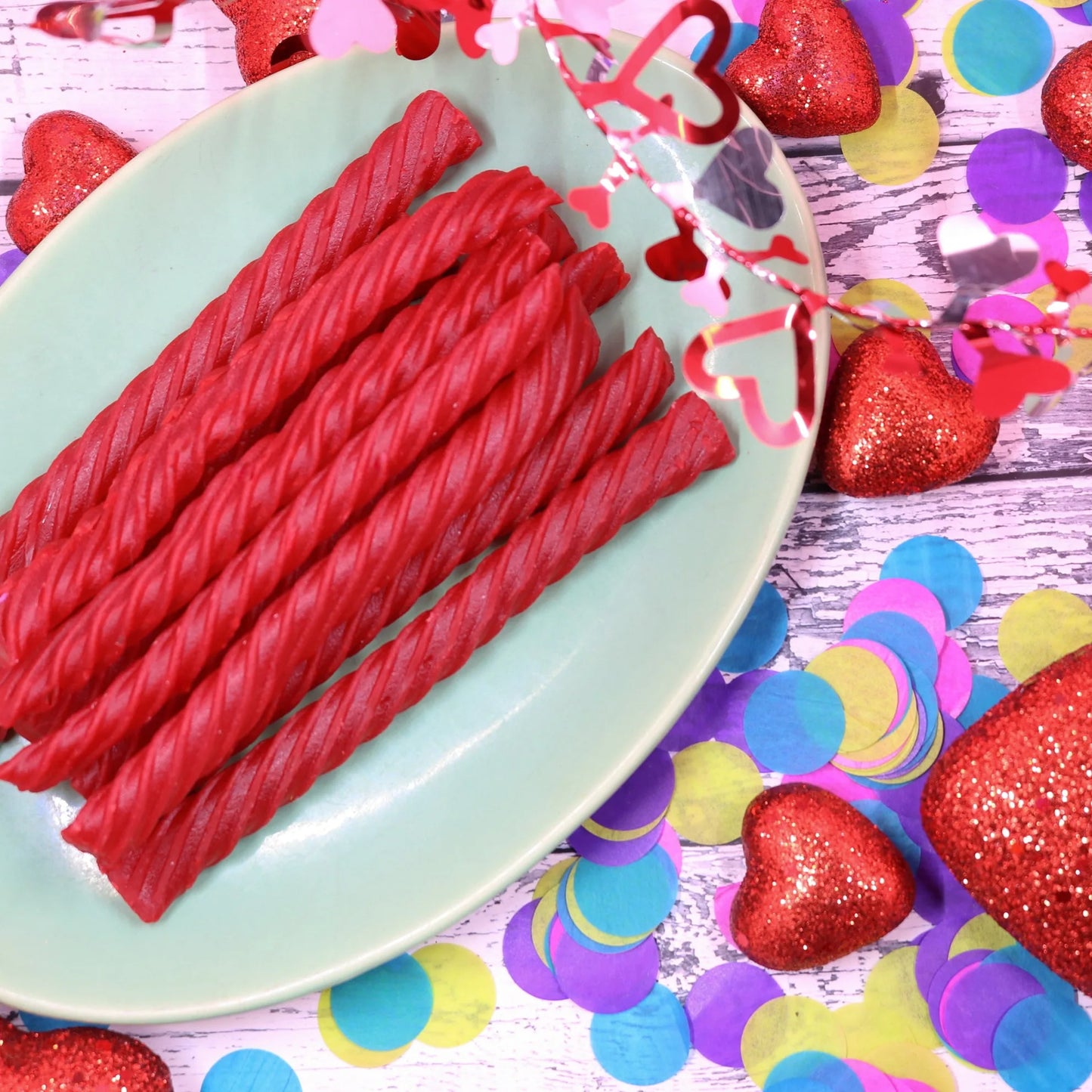 RED VINES Original Red Jumbo Licorice on a platter surrounded by colorful valentine decor