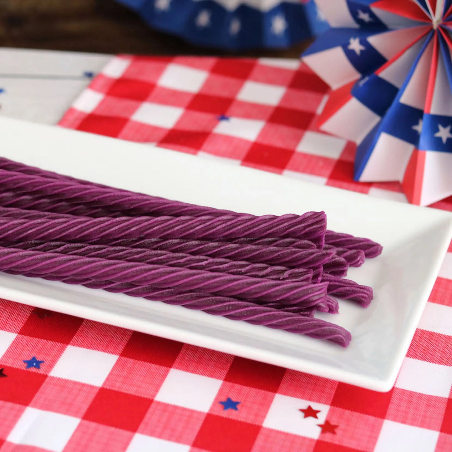 Red Vines Grape Licorice Twists on a picnic table with patriotic decorations
