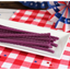Red Vines Grape Licorice Twists on a picnic table with patriotic decorations