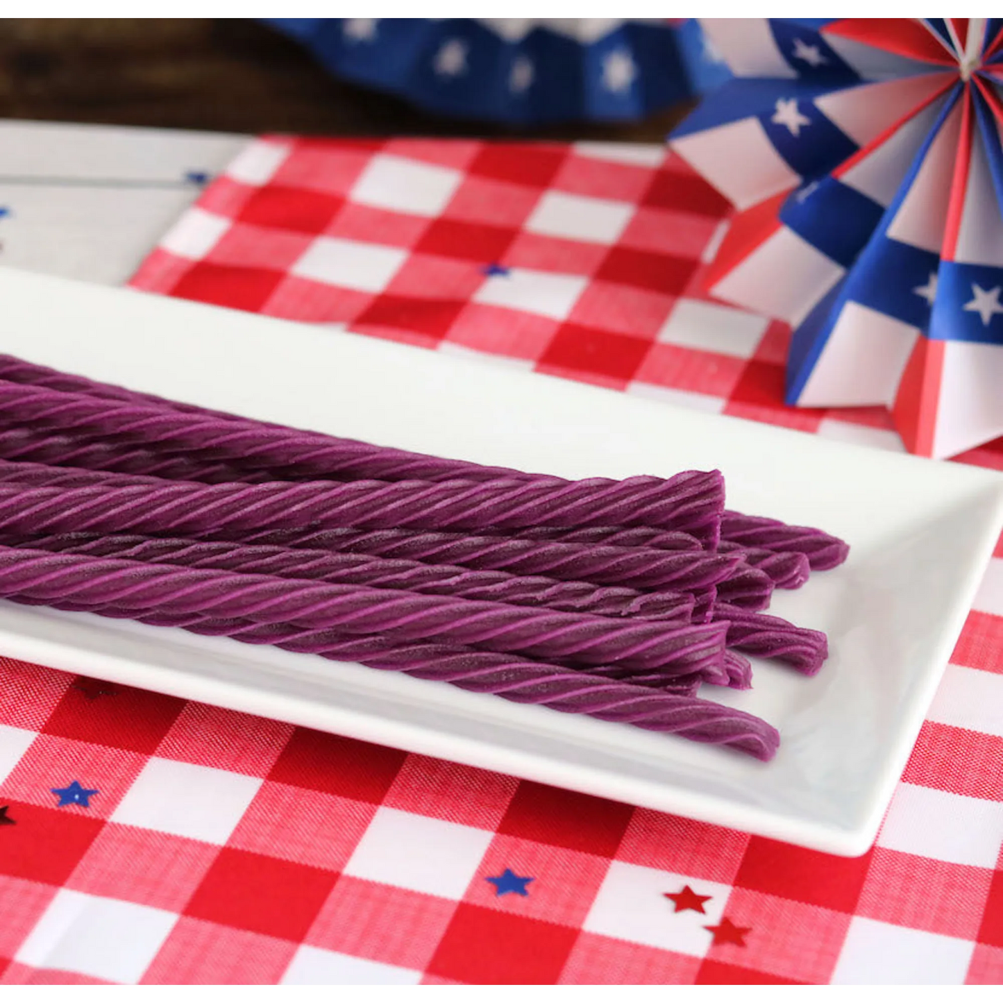 Red Vines Grape Licorice Twists on a picnic table with patriotic decorations