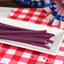 Red Vines Grape Licorice Twists on a picnic table with patriotic decorations