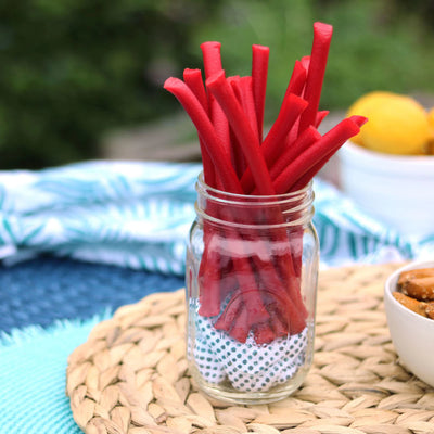 Red Vines Red Ropes Licorice Candy in a jar near other poolside snacks