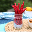 Red Vines Red Ropes Licorice Candy in a jar near other poolside snacks
