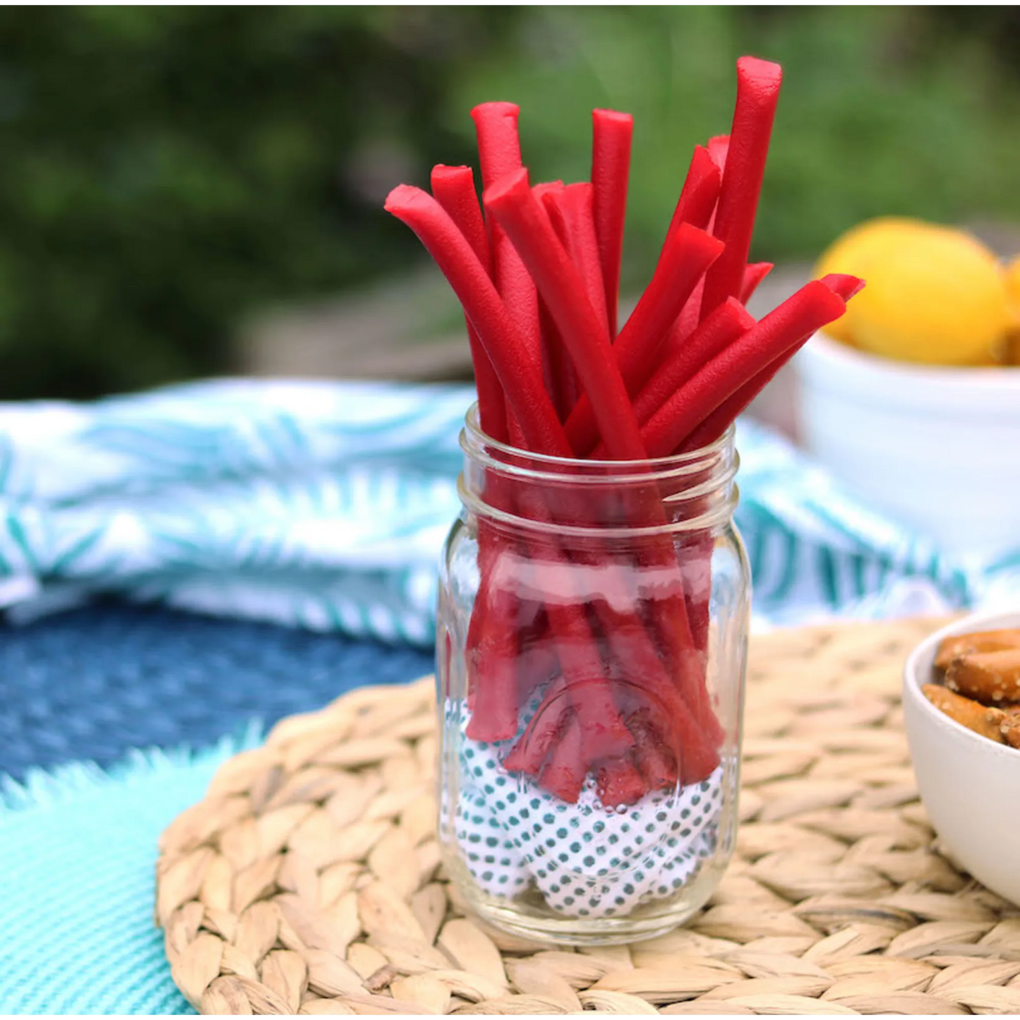 Red Vines Red Ropes Licorice Candy in a jar near other poolside snacks