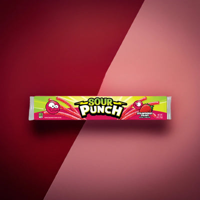 Sour Punch Strawberry Candy Straws 2oz Tray on a diagonally split red and pastel pink background 