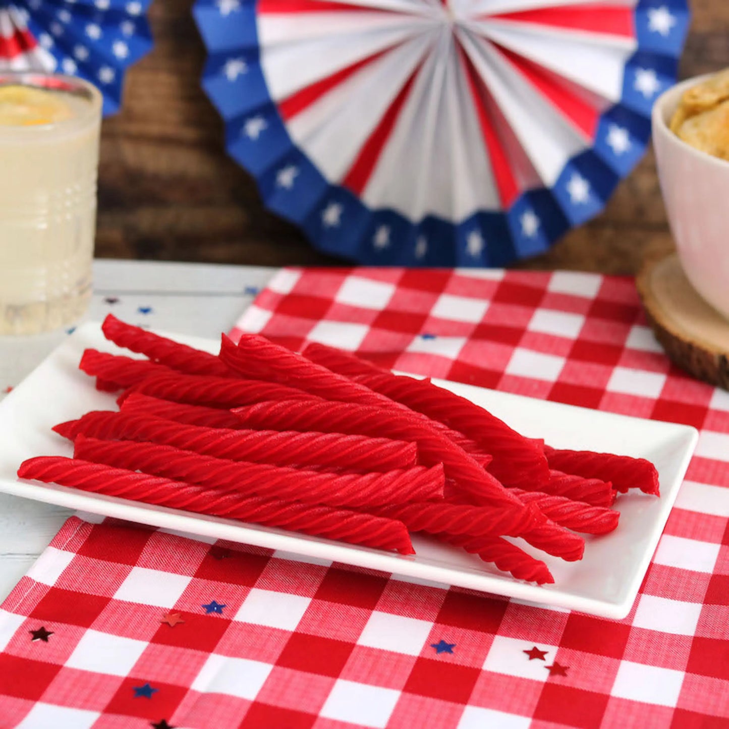Red Vines Original Red Licorice Twists on a picnic table with patriotic decorations
