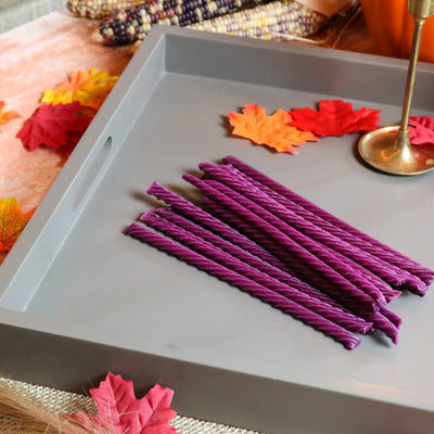 Red Vines Grape Licorice Candy on a gray serving tray with leaves and falltime props