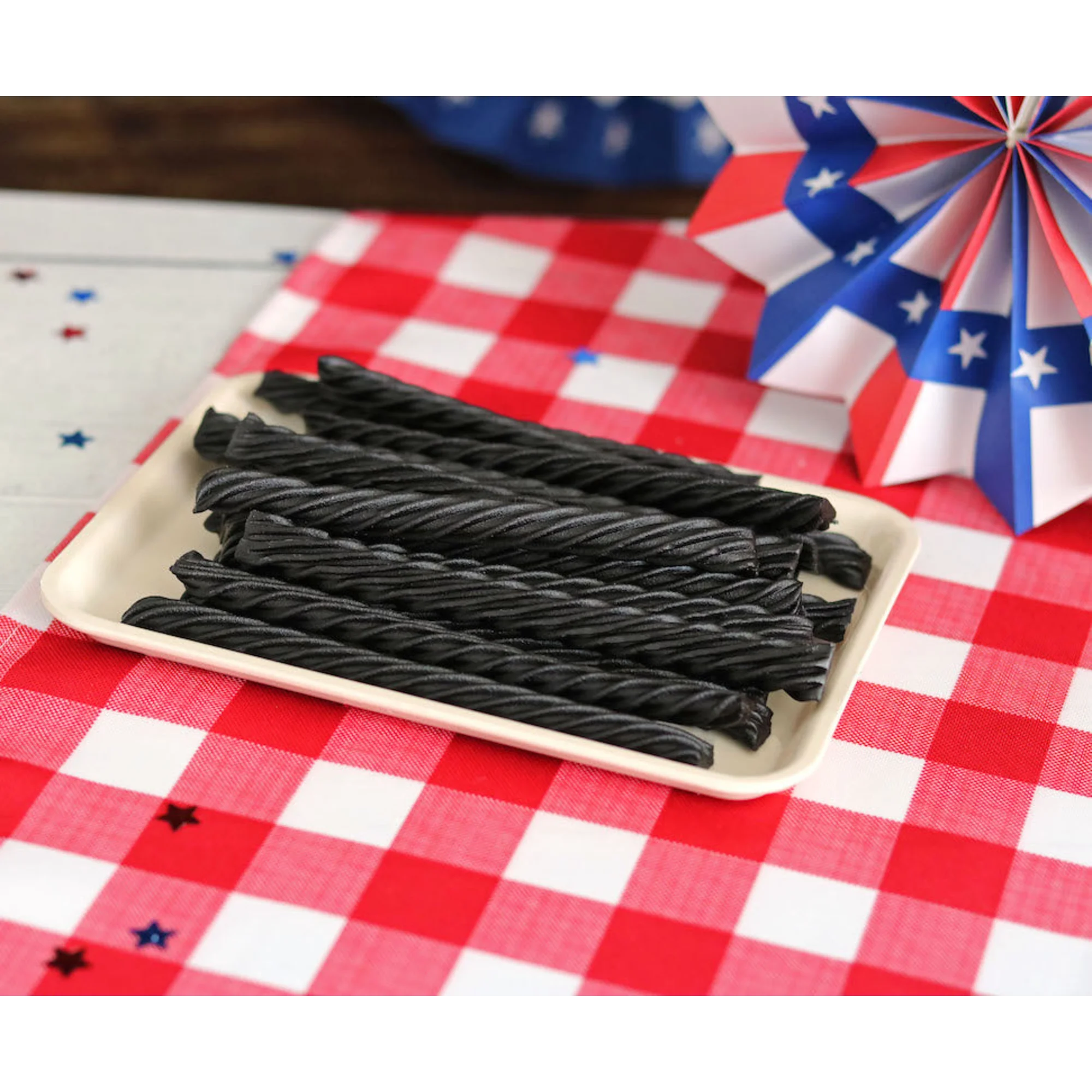 Red Vines Black Sugar Free Licorice Twists on a picnic table with patriotic decorations