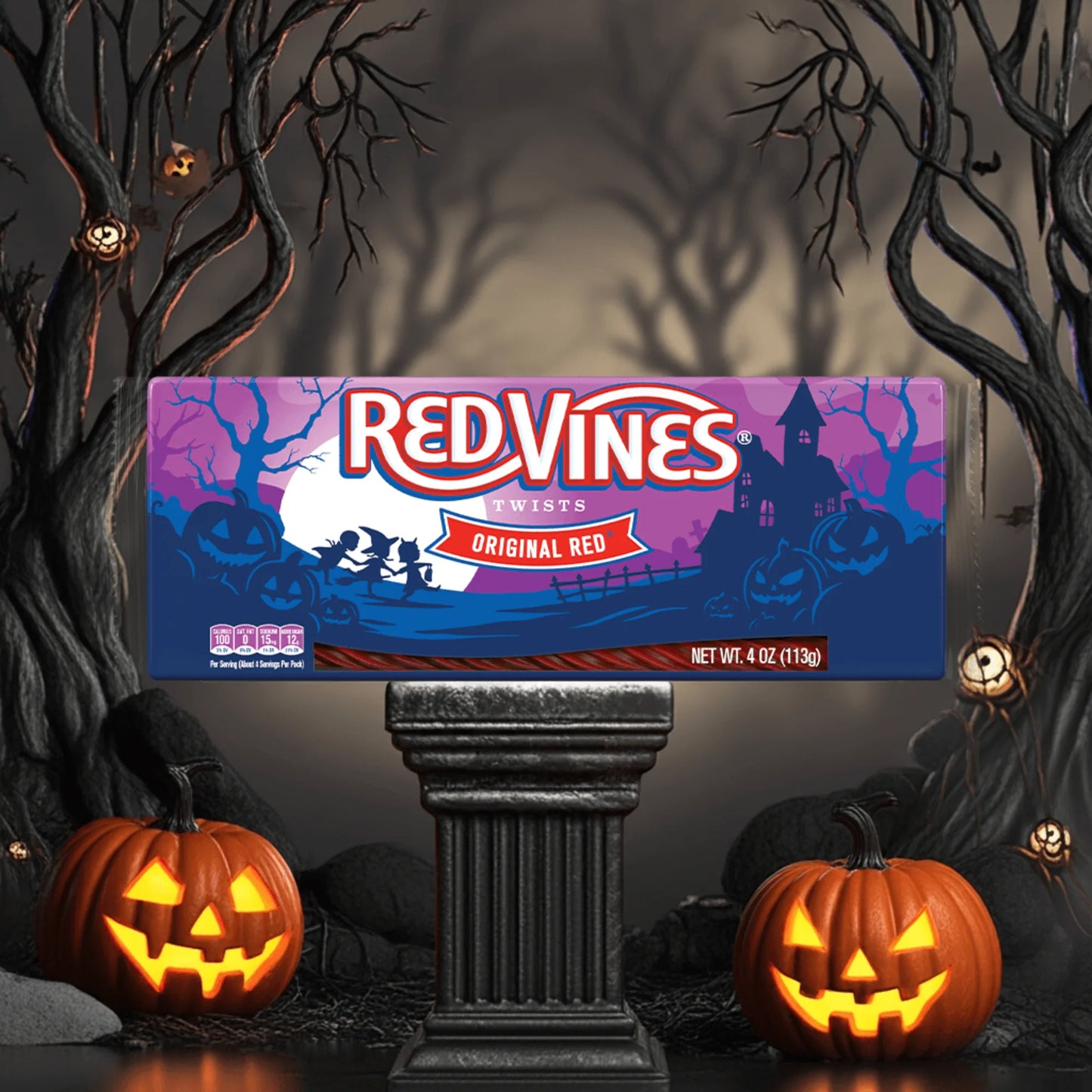 Red Vines Halloween Twists Tray on a pedestal with a spooky background and pumpkins