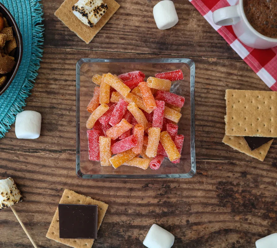 Sour Punch Bites Tropical Flavors alongside s'mores supplies