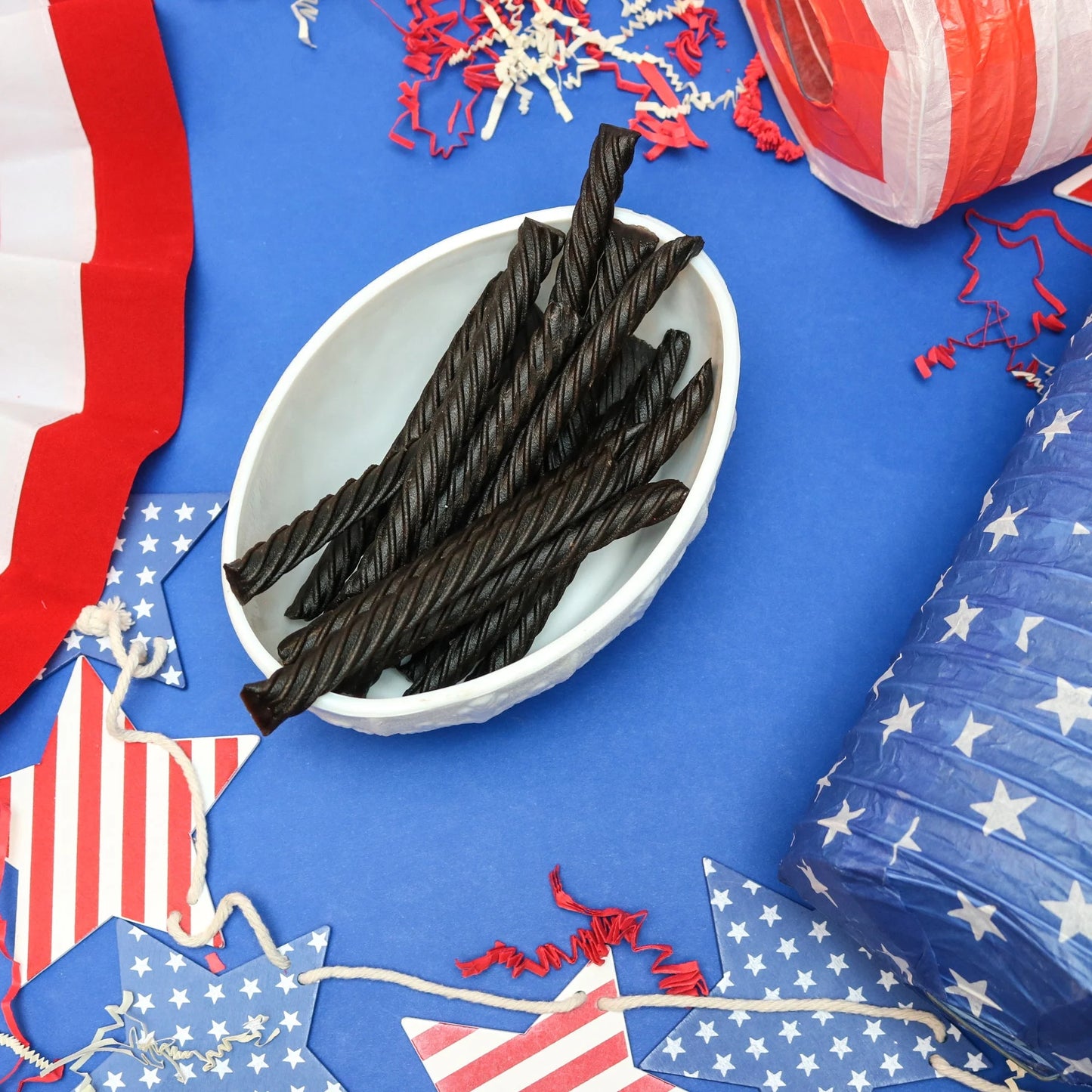 Red Vines Black Licorice Jumbo Twists in a patriotic scene with red, white and blue decorations