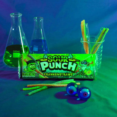 Sour Punch Frankenstraws Halloween Candy 3.2oz Tray in spooky scene with eyeballs and science beakers