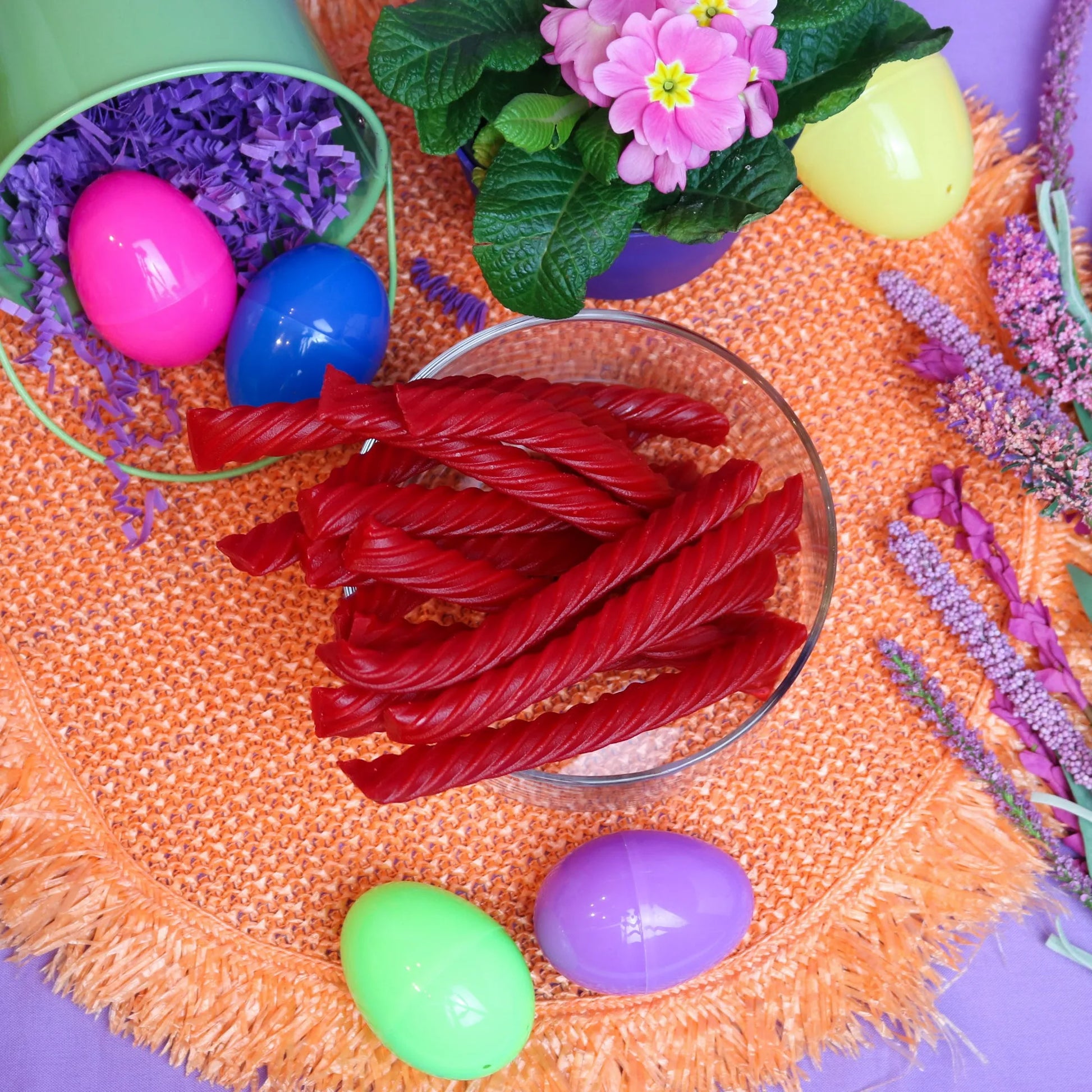 Red Vines Original Red Jumbo Licorice Twists surrounded by plastic Easter eggs