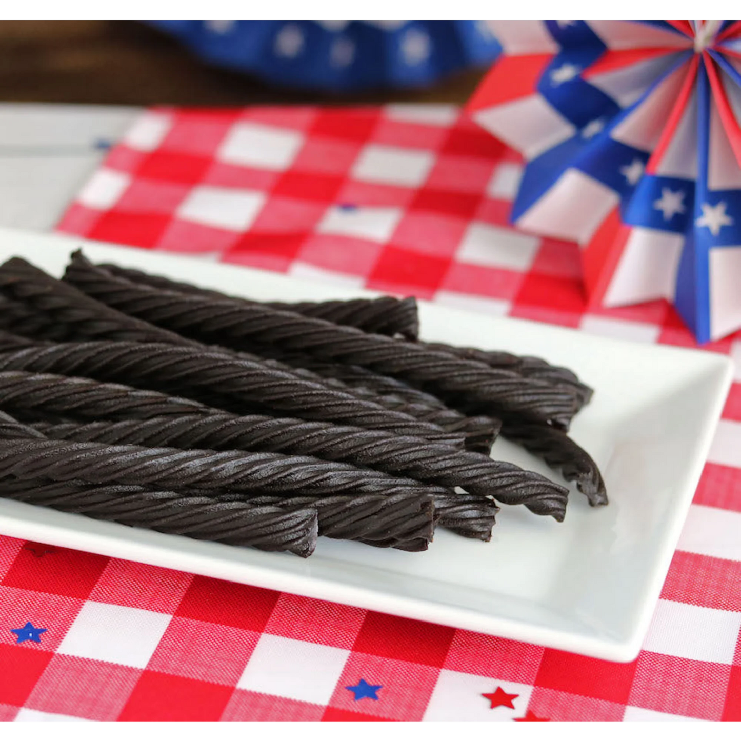 Red Vines Black Licorice Candy Twists on a picnic table with patriotic decorations