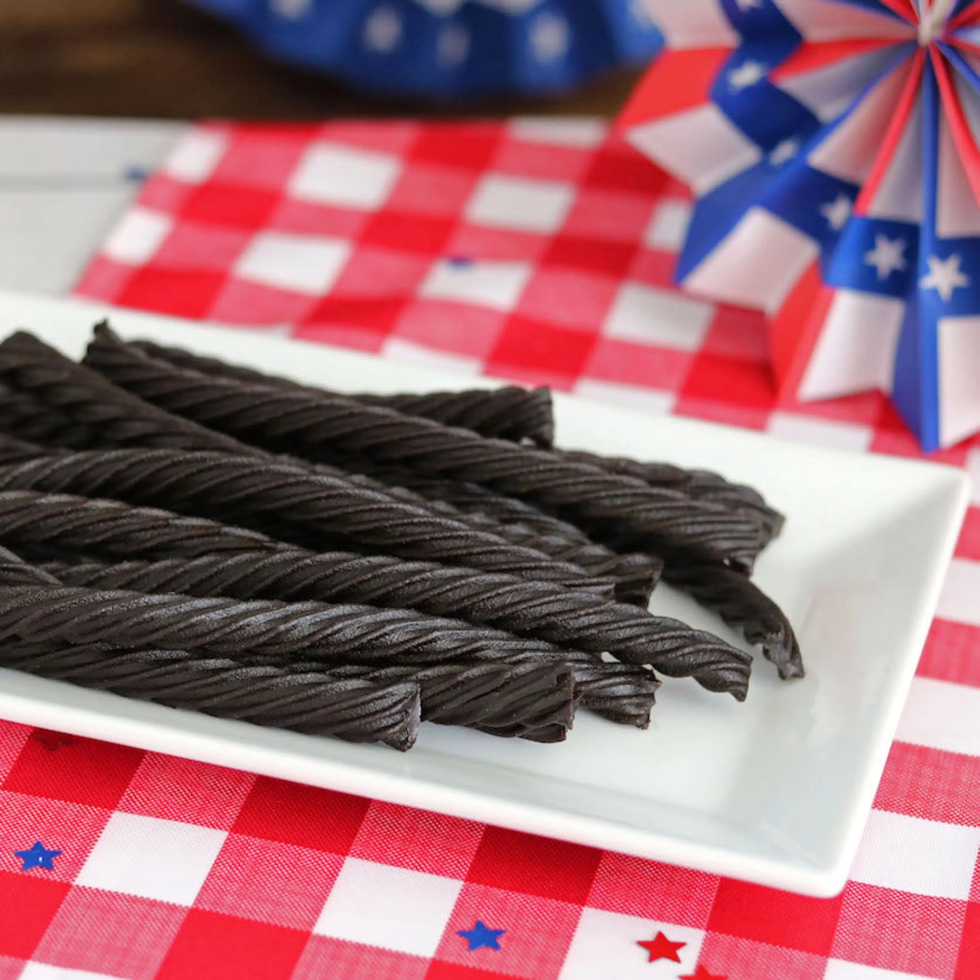 Red Vines Black Licorice Candy Twists on a picnic table with patriotic decorations