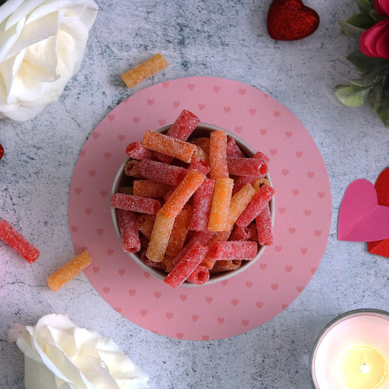 SOUR PUNCH Tropical Bites Candy in a bowl surrounded by heart decor