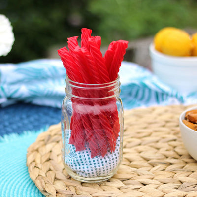 Red Vines Strawberry Licorice Twists, Sugar Free, in a jar near other poolside snacks