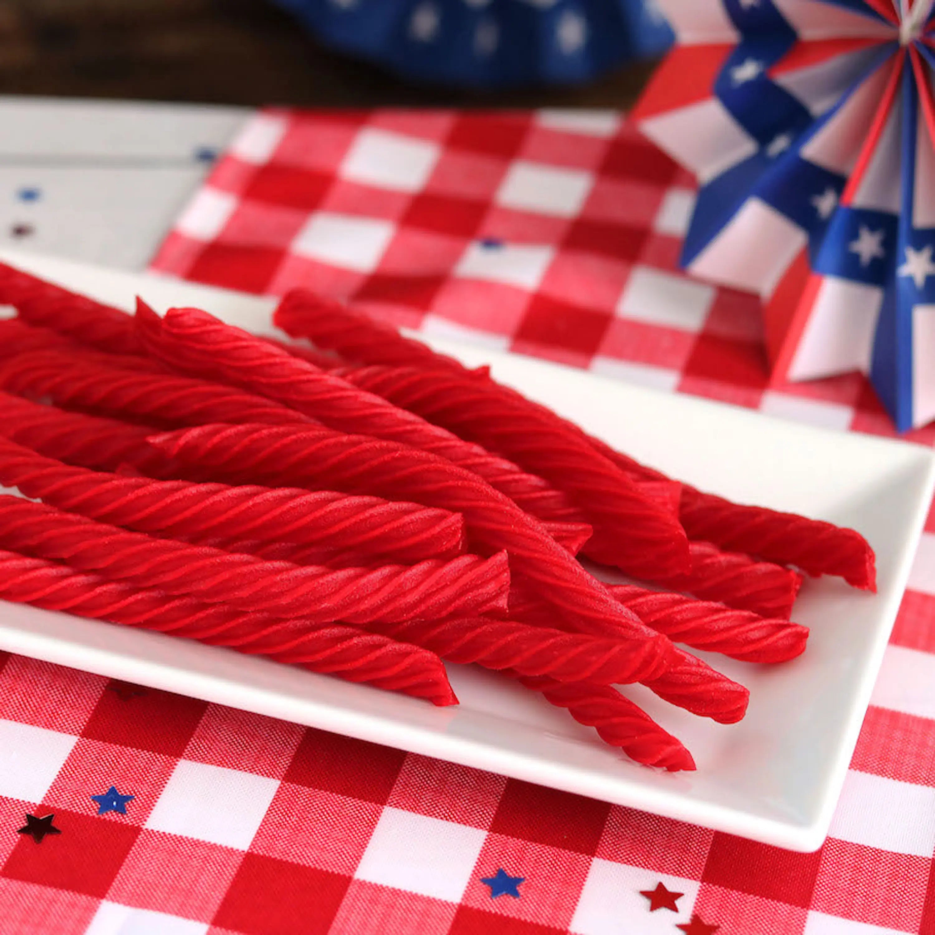 Red Vines Original Red Licorice Twists on a picnic table with patriotic decorations