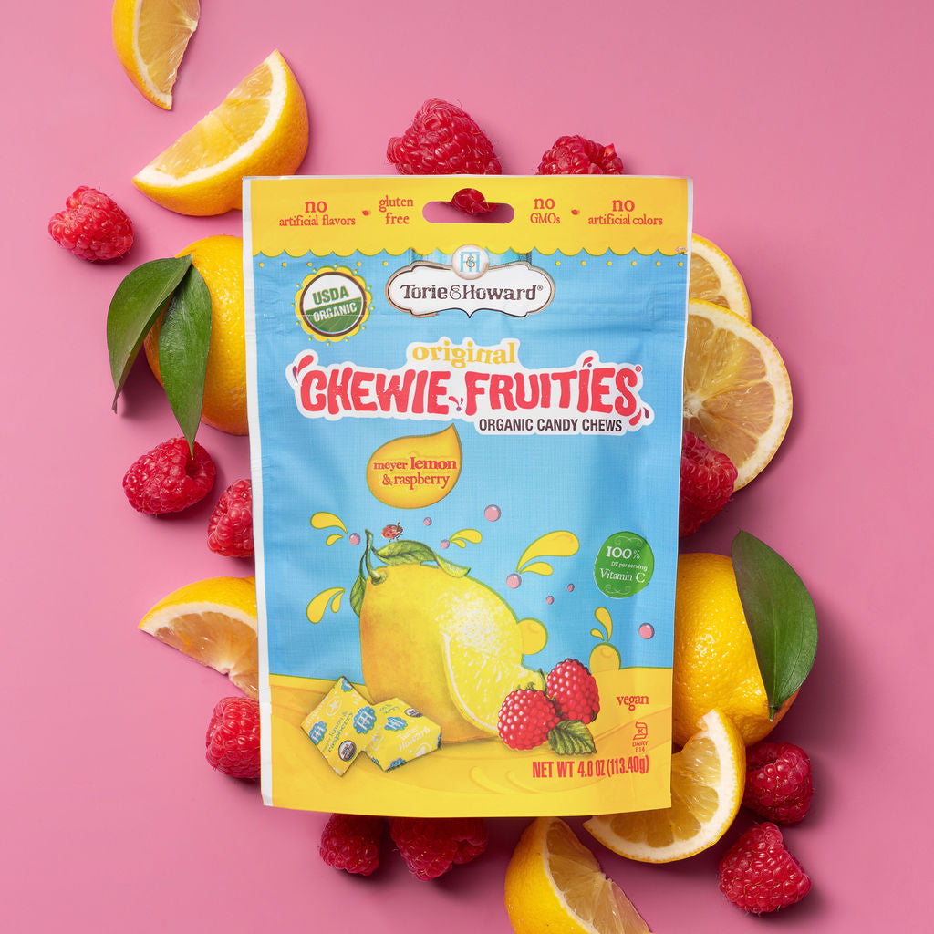 Torie & Howard Chewie Fruities Meyer Lemon & Raspberry Candy on a bed of fresh fruits
