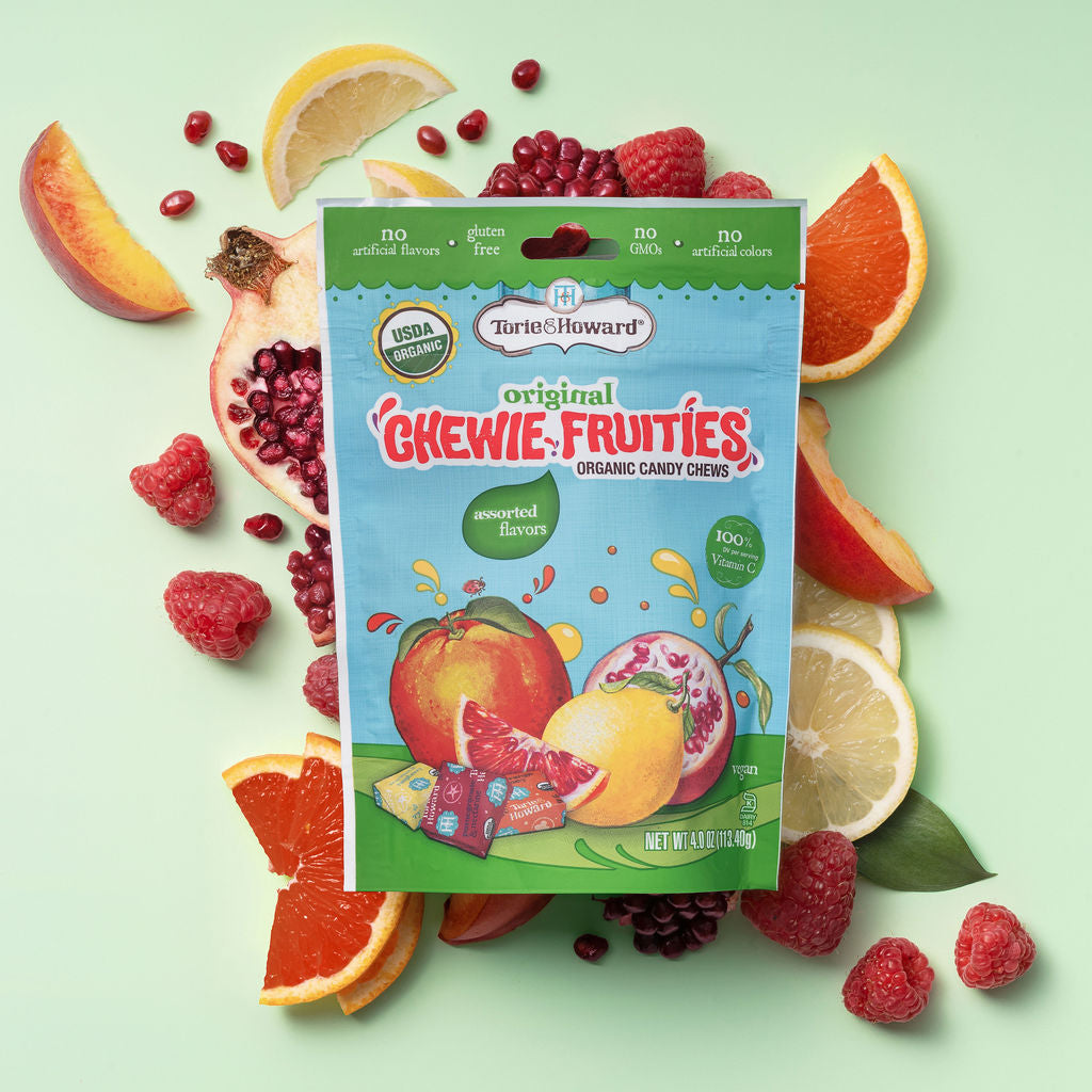 Torie & Howard Chewie Fruities Original Assorted Fruit Candy Flavors on a bed of fresh fruits